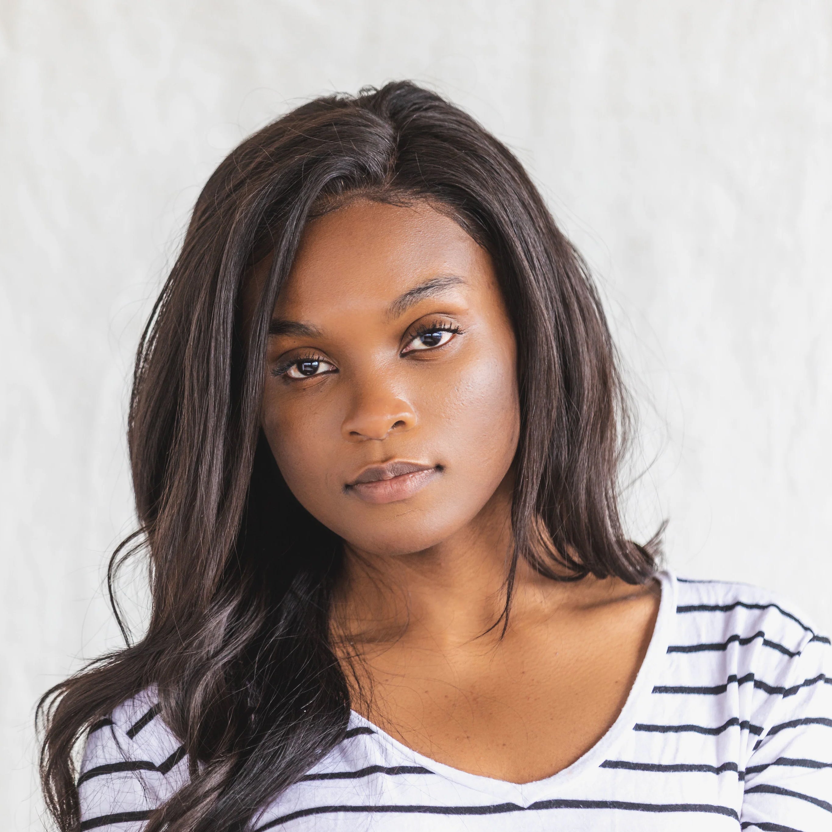 files/a-young-woman-posing-in-a-black-and-white-shirt.jpg